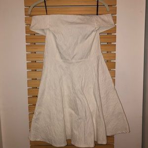 Off the shoulder white dress.